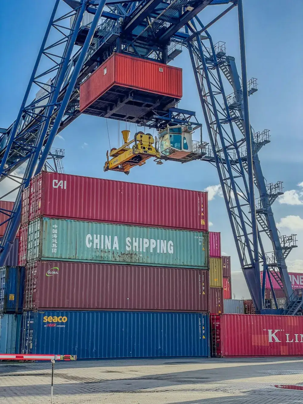 Container crane loading a truck in a UAE port